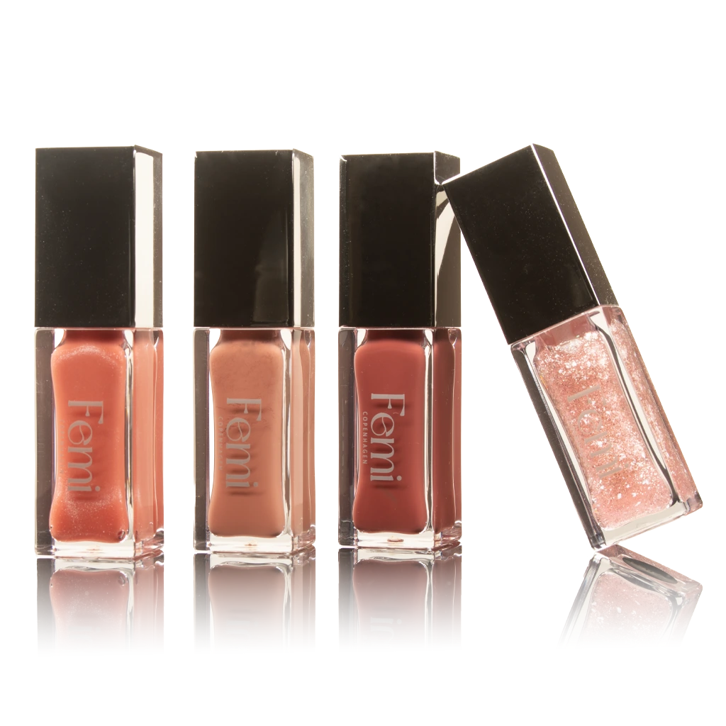 Femi Copenhagen lipgloss kollektion med nude, rosa og glitrende pink nuancer – højglans lipgloss i luksuriøs klar akrylbeholder